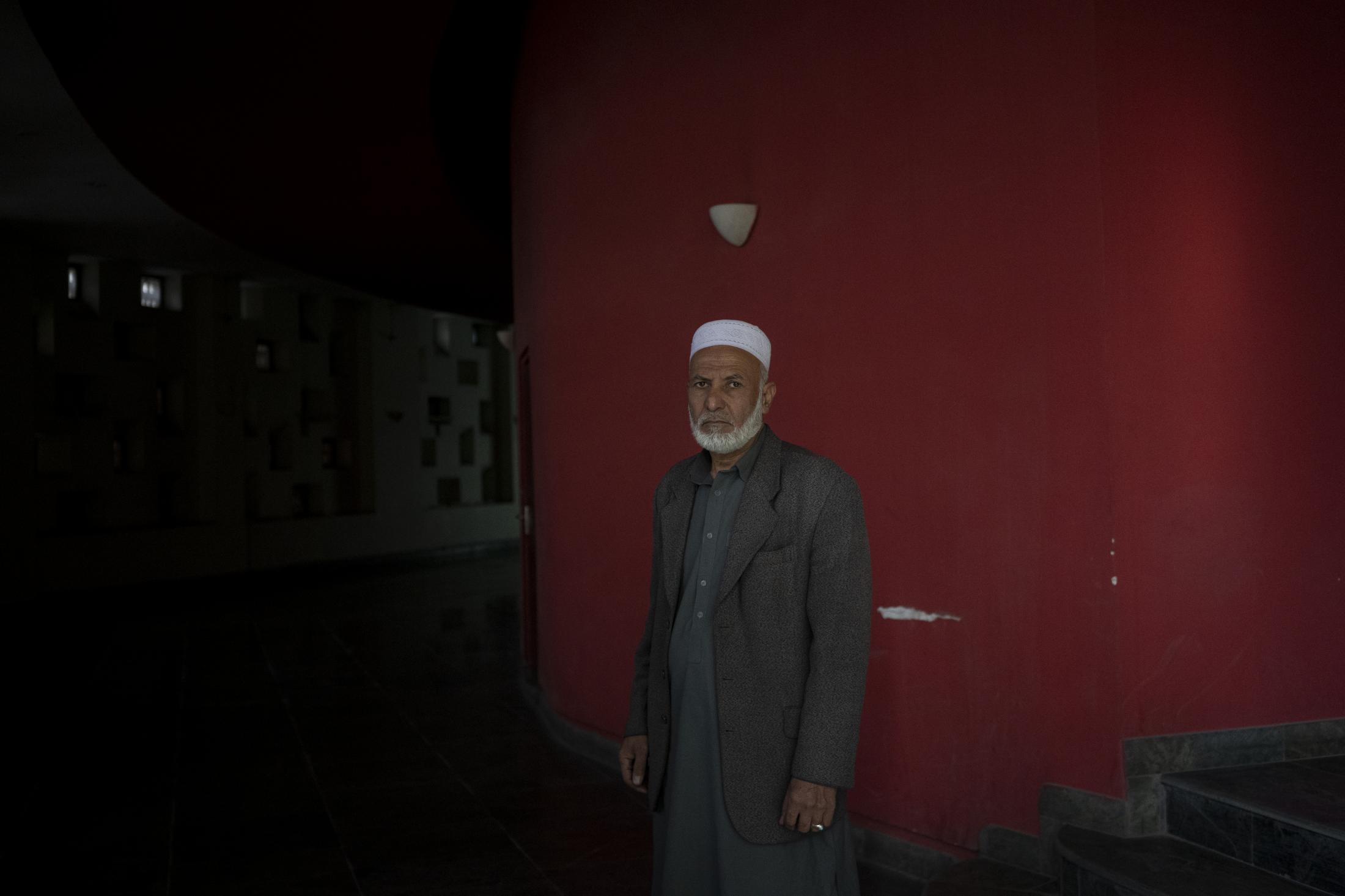 The Cinema of Kabul - Rahmat Shah, who works as a host, poses for a photograph...