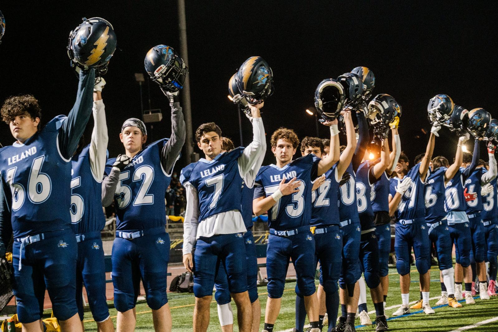 Image from SPORTS - Leland High School football players stand for the...