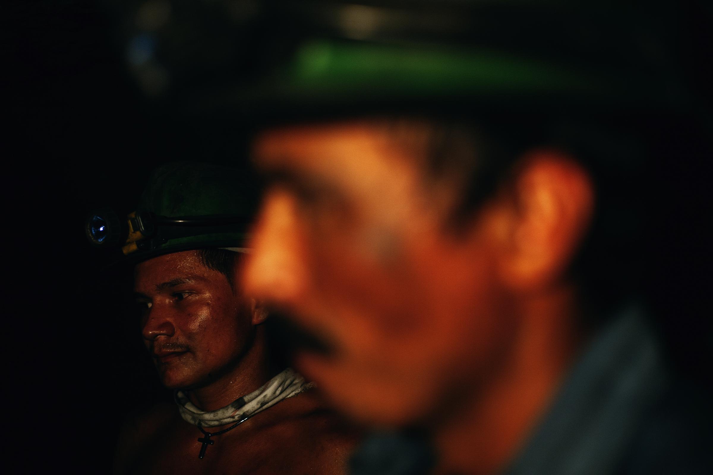 Muzo - Muzo, Boyacá, Colombia. Two miners work inside an...