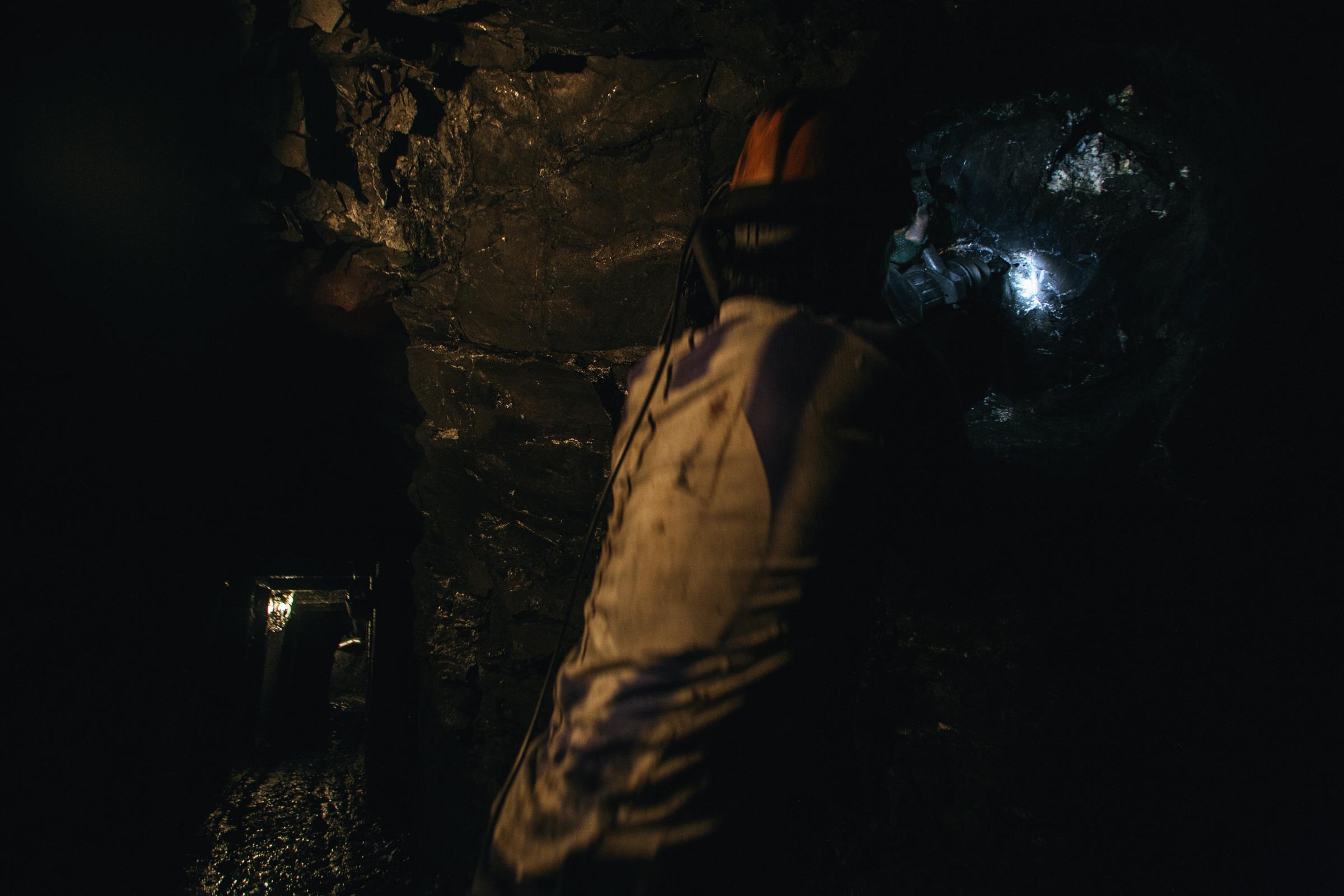 Muzo - Muzo, Boyacá, Colombia. A miner uses a drill to...