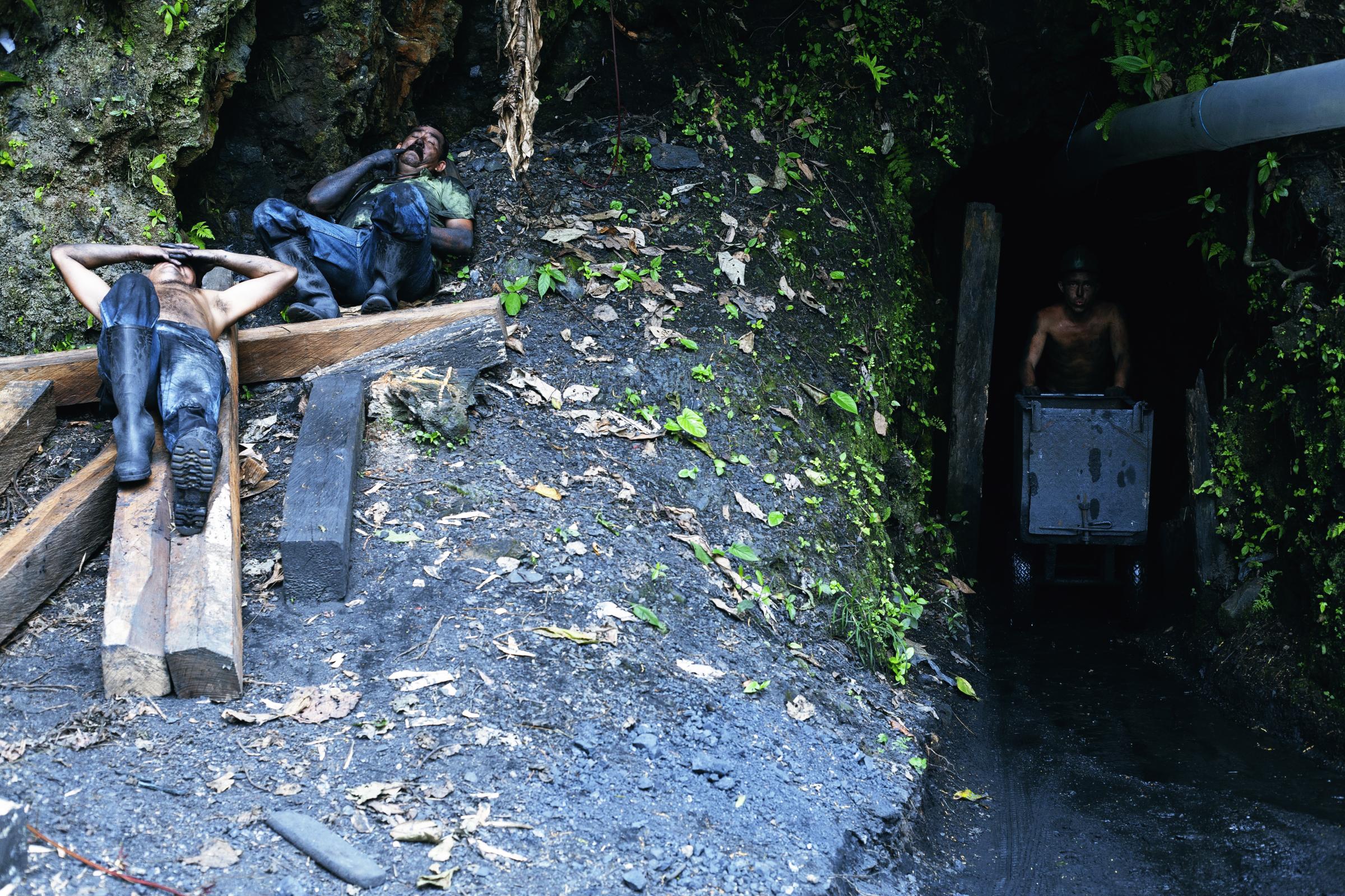 Muzo - Muzo, Boyacá, Colombia. Two miners rest after...