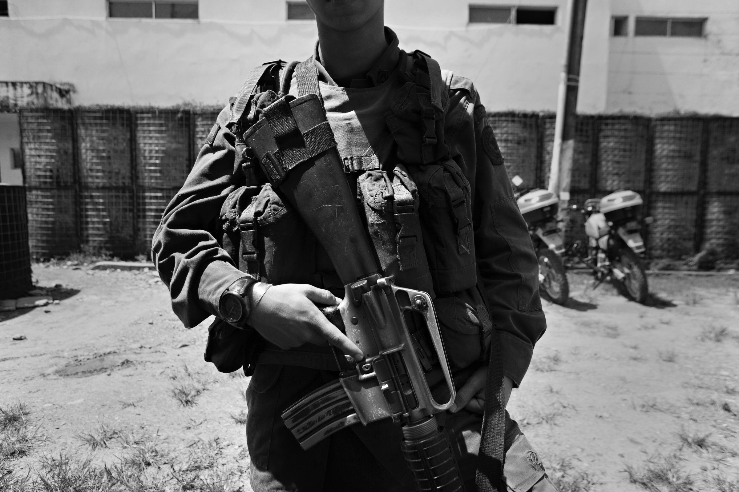 50 years of FARC - Police with their M16 outside the Mesetas police station,...