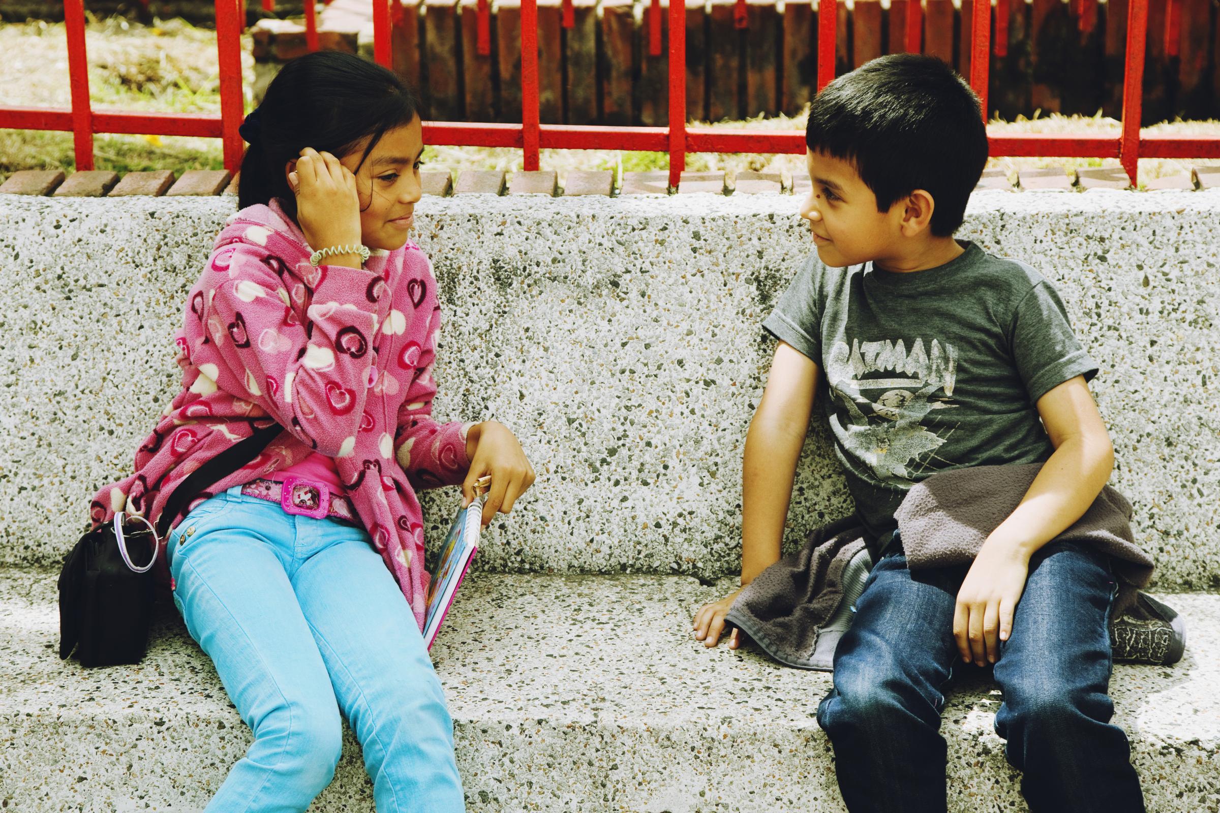 Boyacá - Two children talking in the center of Paipa,...