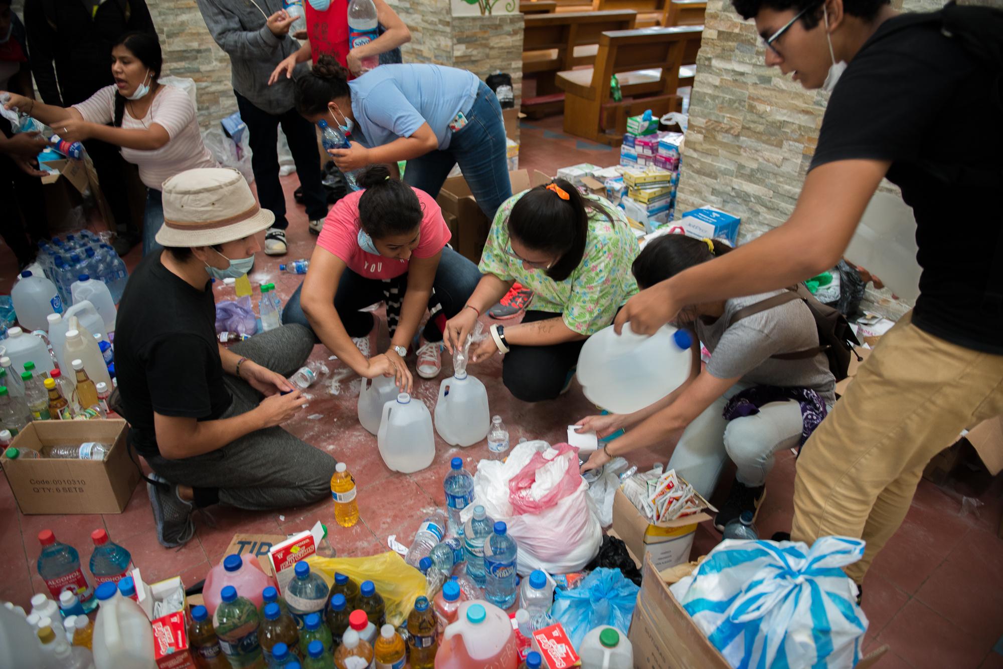 Medical students prepare bottles of a solution to counter the effects of tear gas inside the cathedral of Managua during clashes with police....