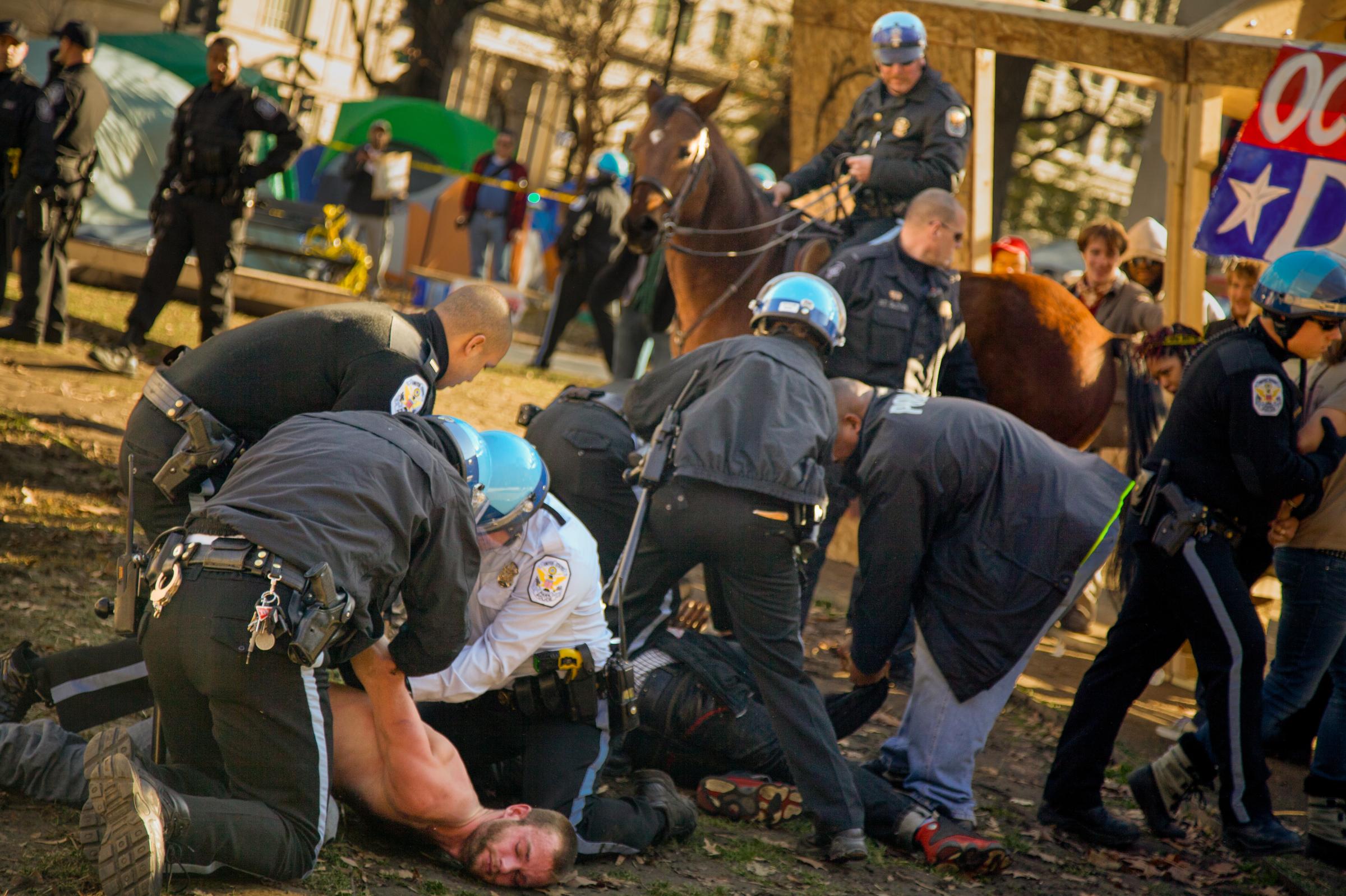 DC: City of Protests - Caption: U.S. Park Police arrest protestors who broke...
