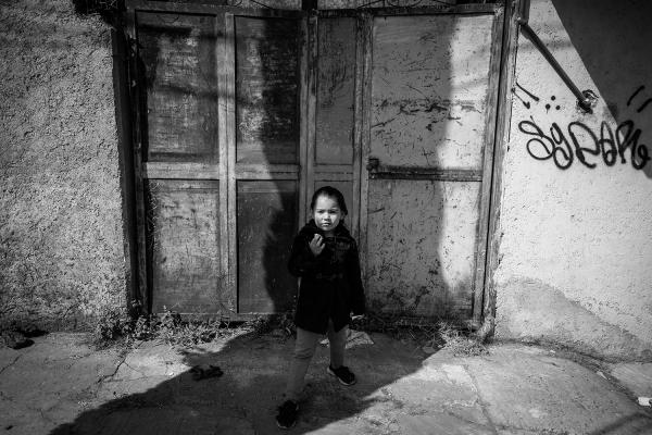 SUBSTITUTE MOTHER - Portrait of Nicole in the streets of the neighborhood where they live since mid-2019 south of...