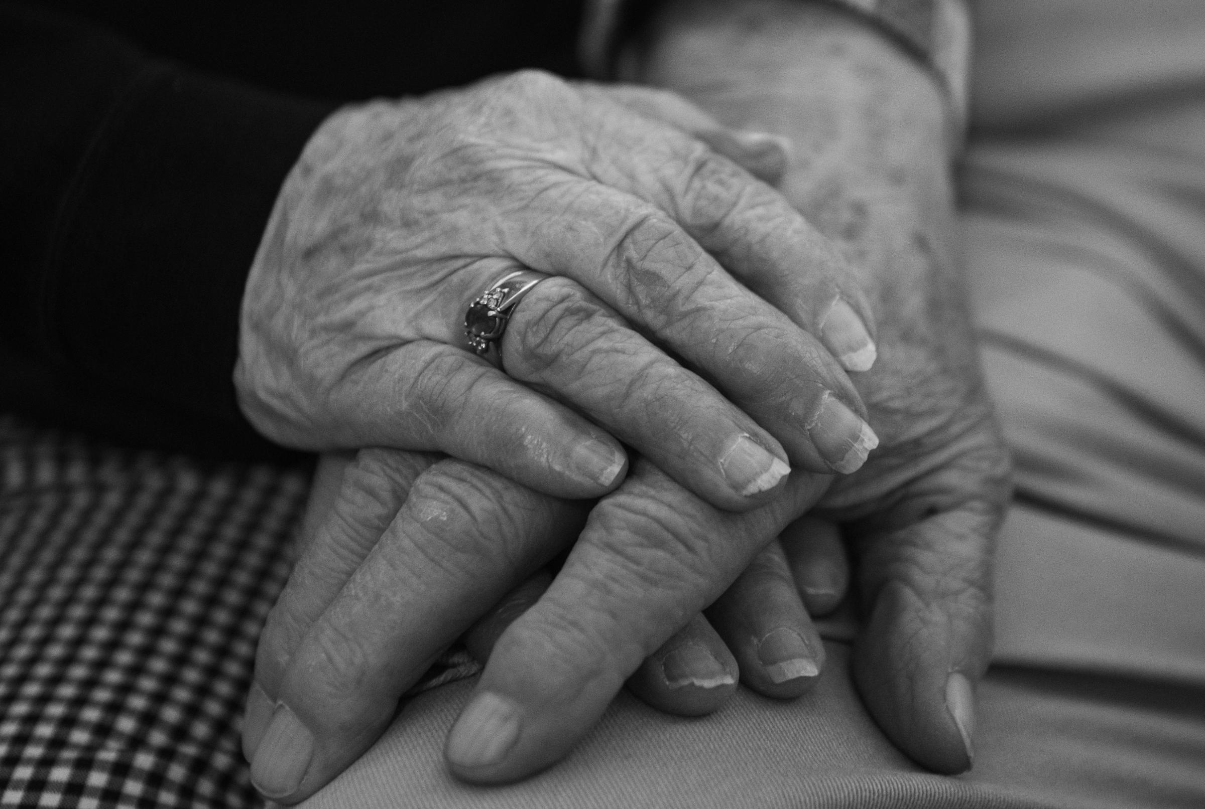 75 Years of Togetherness - Bettie clasps Charlie's hand during a conversation at...