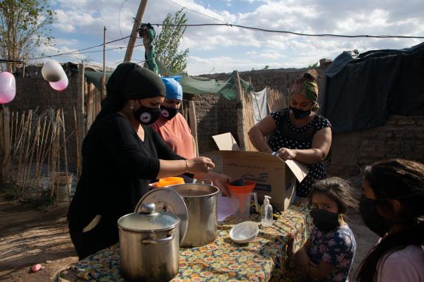 Martina Chapanay - Dani preparing afternoon snack and chocolate for children in the slum, as every day at 6pm after...