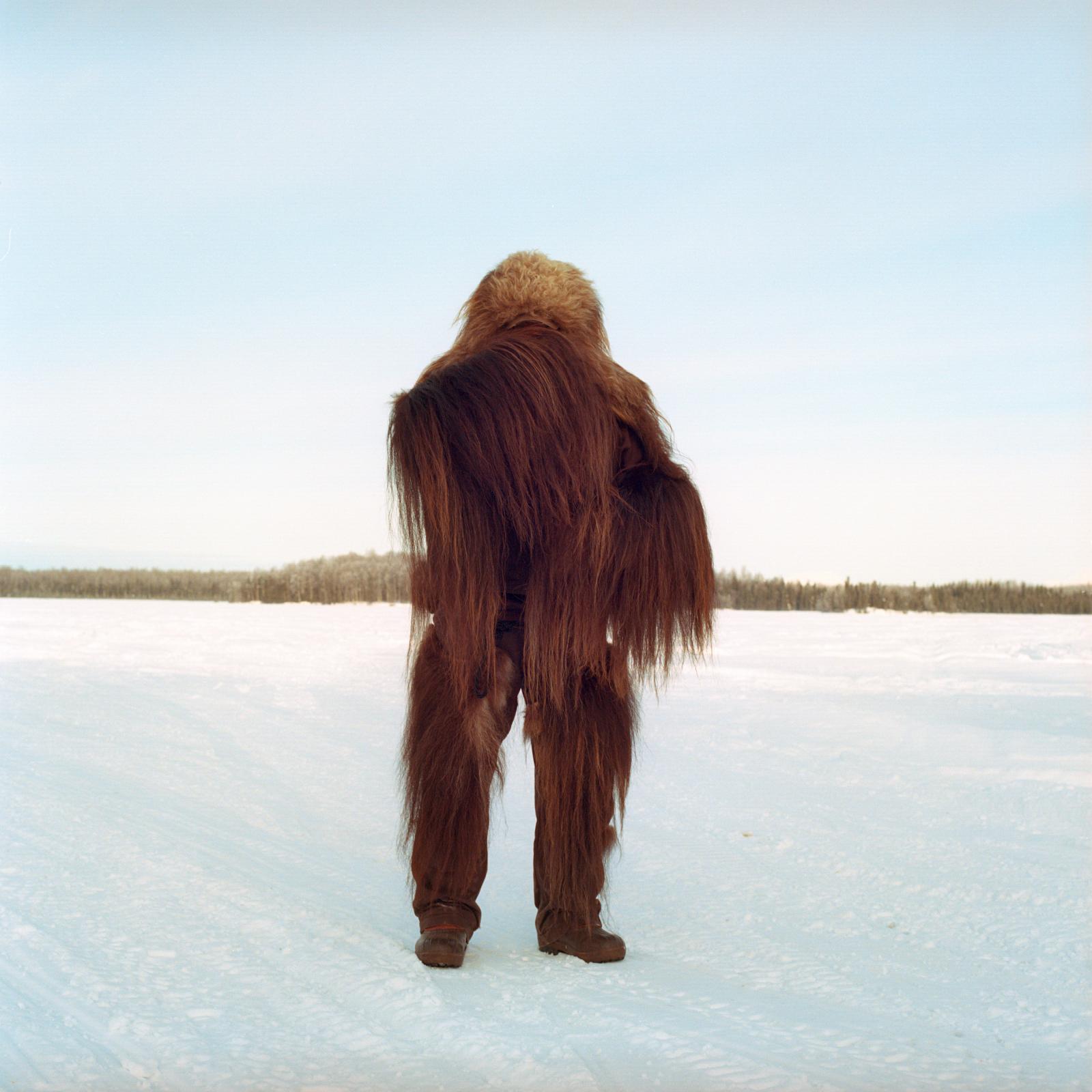Print Sale - A spectator dresses like bigfoot during the Iditarod dog...