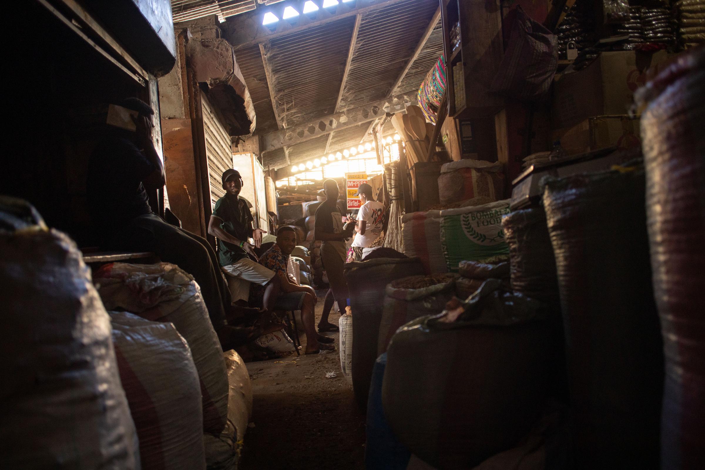 Covid Coverup - Daily life unfolds in a section of Kariakoo Market on 25 October 2021. The market - whose...