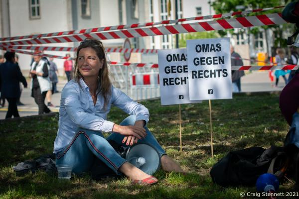 ERFURT, GERMANY-MAY 01: A supporter of Omas gegen Rechts (Grannies against the Right) takes a rest while at the May Day &#39;Against Bj&ouml;rn H&ouml;cke&#39; (of the AfD) demonstration in Erfurt, Thuringia in 2019. Germany. The initiative Omas gegen Rechts was founded in Vienna in 2017 by journalist Susanne Scholl and Monika Salzer, a retired pastor. Salzer said that it was in response to the coalition of the Austrian People&#39;s Party and the Freedom Party of Austria during the first Kurz government. A German initiative of Omas Gegen Rechts was founded in 2018 initiated by former teacher Anna Ohnweiler. (Photo by Craig Stennett/Getty Images)