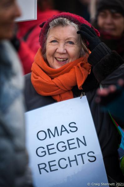 BERLIN, GERMANY-DECEMBER 21: Marion Geisler from Omas gegen Rechts (Grannies against the Right) at the &quot;Wir haben es satt&quot; demonstration at Brandenburger Tor, Berlin, 2019: &#39;&#39;As a post-war child, the fear of my parents and grandparents of &#39;authority&#39; is written into my genes. But I do not want to be scared, that&#39;s why I&#39;m standing here. I want to encourage myself to fight hatred, xenophobia, intolerance and stupidity. Freedom is our highest goal and it is necessary to defend it everywhere.&quot; The initiative Omas gegen Rechts was founded in Vienna in 2017 by journalist Susanne Scholl and Monika Salzer, a retired pastor. Salzer said that it was in response to the coalition of the Austrian People&#39;s Party and the Freedom Party of Austria during the first Kurz government. A German initiative of Omas Gegen Rechts was founded in 2018 initiated by former teacher Anna Ohnweiler.(Photo by Craig Stennett/Getty Images)