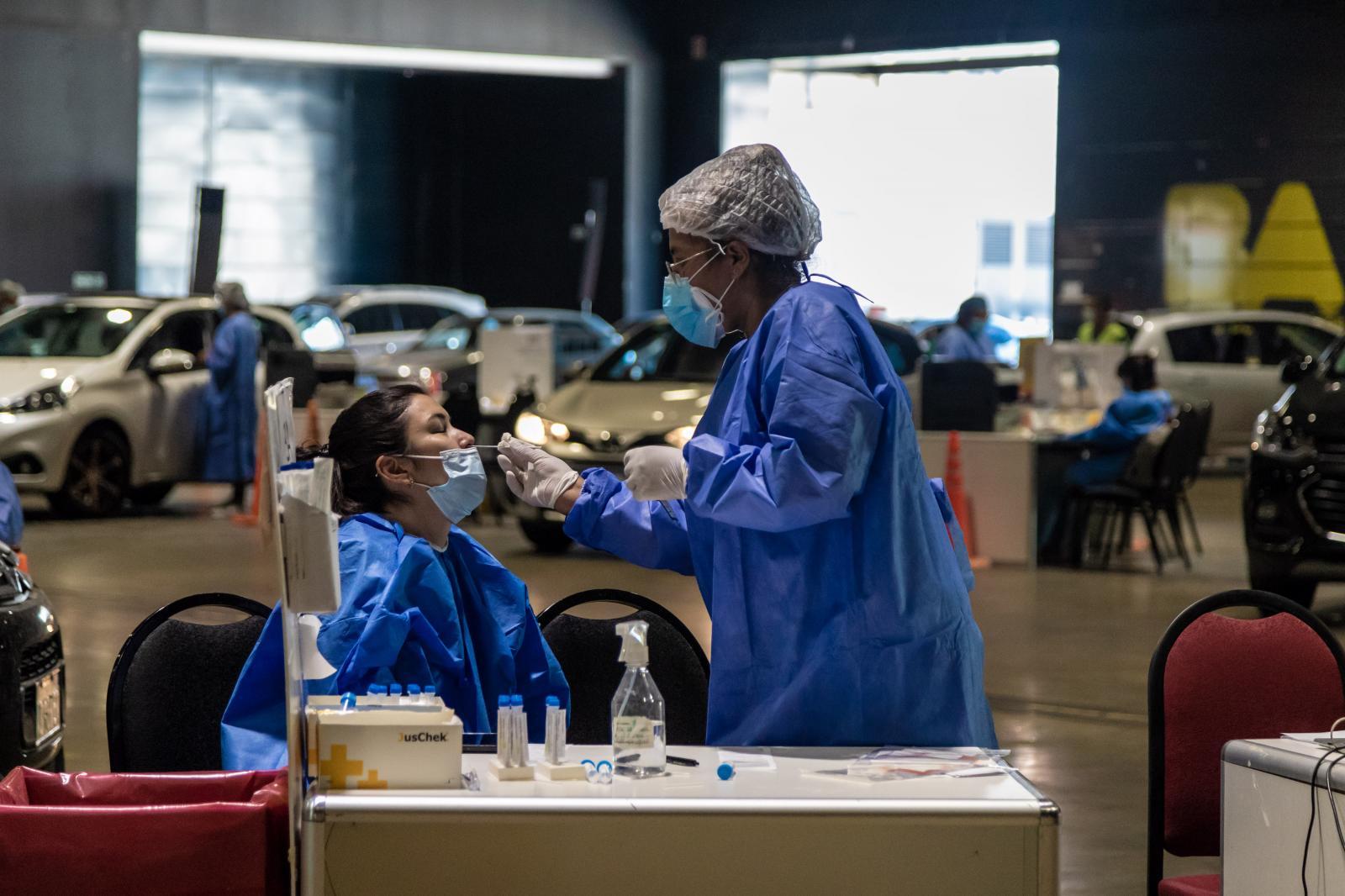 A healthcare worker administers...Anita Pouchard Serra/ Bloomberg