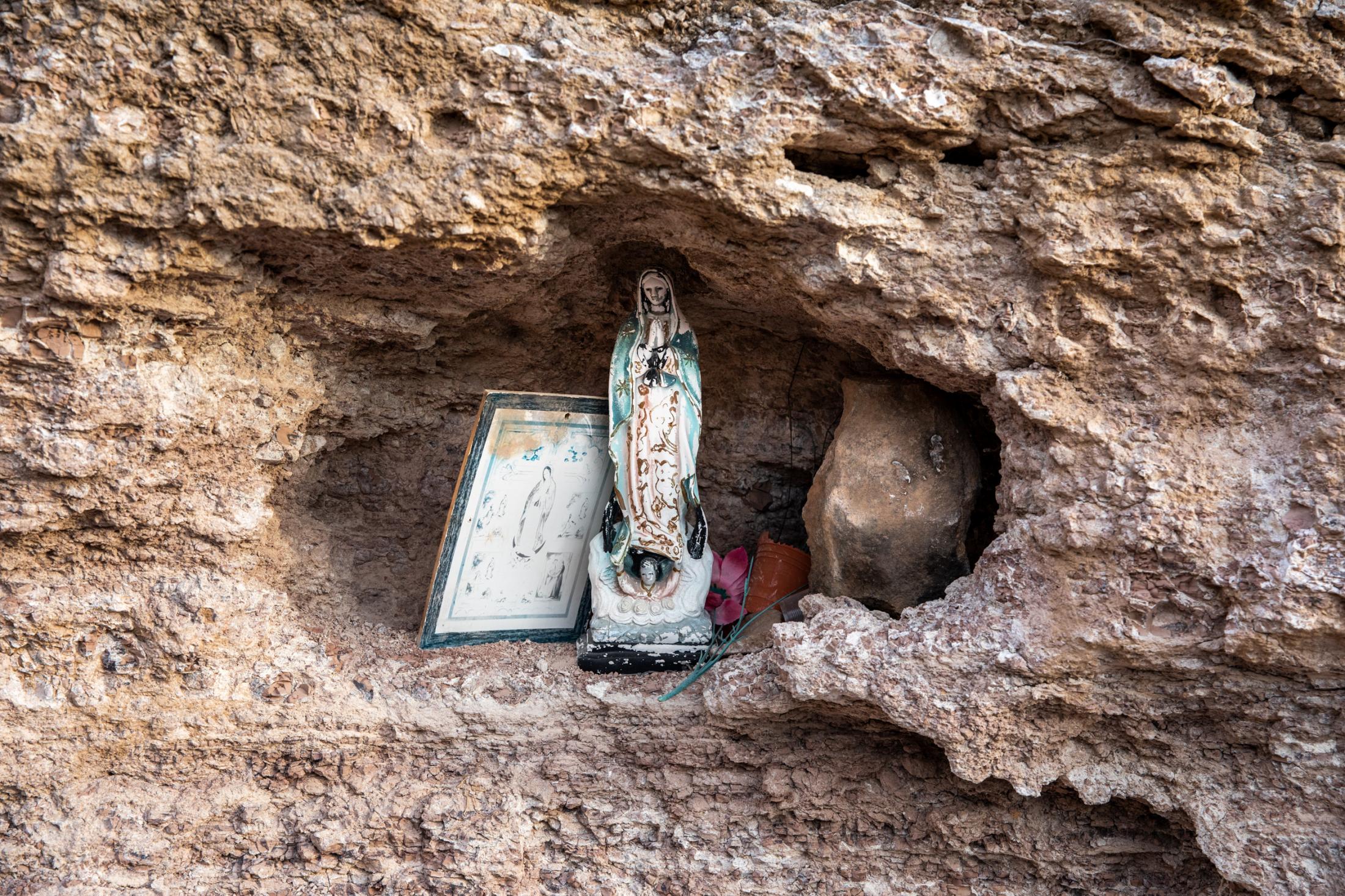 Until We Are Gone - Baja California -  Ornaments are placed in a rock crack in the mountain...