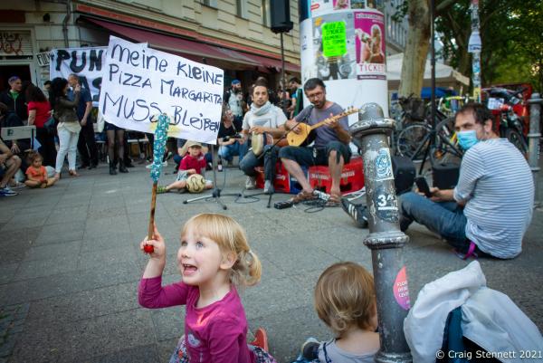 BERLIN, GERMANY-JULY 13: Demonstrators in Kreuzberg, Berlin for &#39;De Noantri muss bleiben- Punto e Basta.&#39; De Noantri muss stay-Full Stop&#39; in 2020. The Pizzeria of De Noantri has been in G&ouml;rlitzer Str, Kreuzberg, Berlin for over 10 years. Its a well known establishment and meeting point for locals. Providing an affordable meal out or take away service. Its continued tenancy is under threat with new owners and increased property rental. A situation which is effecting many small businesses in Berlin. Over 80% of Berlin&lsquo;s 3.7 million residents rent their homes. On 26th September 2021 the city of Berlin held a non binding referendum on whether to nationalize thousands of housing units owned by real estate giants. Over 56% of Berliner&lsquo;s voted in favor of the measure. Voters were asked if they approved of the expropriation of the property of private real-estate companies with 3,000 or more units in the city, through public purchases by the Berlin state government. This would affect 243,000 rental apartments out of 1.5 million total apartments in Berlin. In total, the referendum would impact 12 large real-estate companies.(Photo by Craig Stennett/Getty Images)