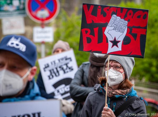 BERLIN, GERMANY-APRIL 22: Protesters demonstrate in support of the Oranienstra&szlig;e bookshop Kisch &amp; Co at Moabit Criminal Court in Berlin on April 22nd 2021. The bookshop Kisch &amp; Co has been a fixture on Oranienstra&szlig;e in Kreuzberg for over 23 years. However, the property was bought up by a real estate fund: Victoria Immo Properties based in Luxenburg. The new rent was beyond Kisch &amp; Co&#39;s means and they instead had asked for an affordable and fair rent for a bookshop. This was rejected by the real estate fund and the case of dispute ended up at Court in Berlin. The courts decision on April 22, 2021 was as Kisch &amp; Co owner Thorsten Willenbrock had expected: The bookshop must leave the premises in Oranienstra&szlig;e and also pay the costs of the proceedings. (Photo by Craig Stennett/Getty Images)