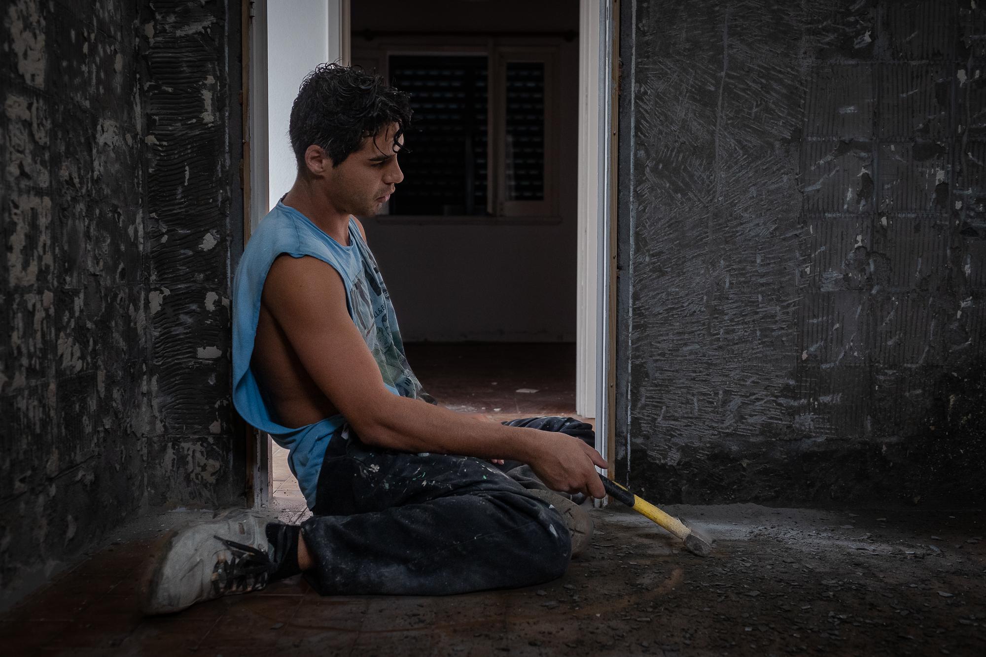 F&aacute;bio Medeiros takes a break after being most of the afternoon breaking tiles on a...