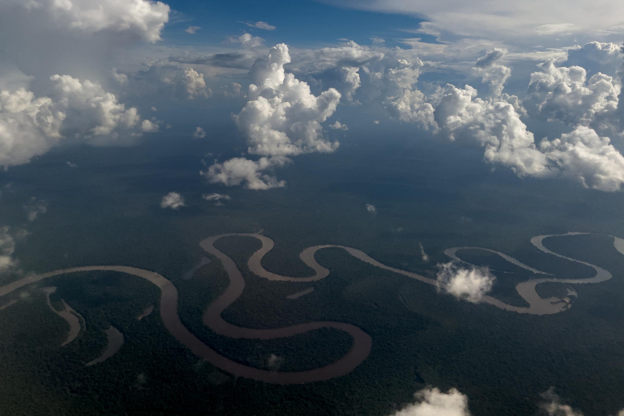 Vaccinators in Peru's Amazon are challenged by religion, rivers and a special tea - Aerial view of the amazon river in Iquitos, Peru.