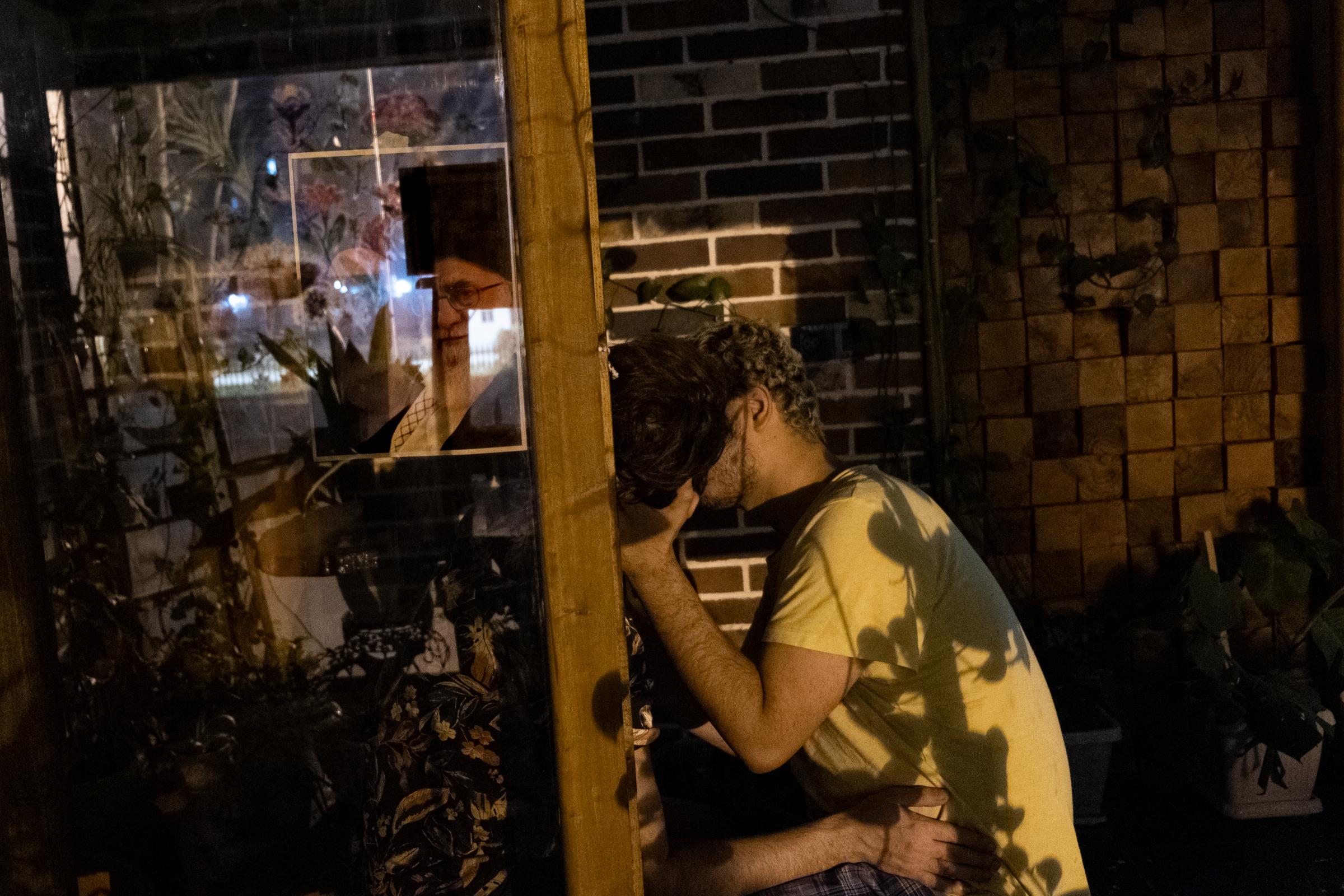 Iran. Lahijan, 2 December 2021 - A self-portrait of Ashkan kissing his partner in a quiet place at a friend&#39;s shop in the night. They met...