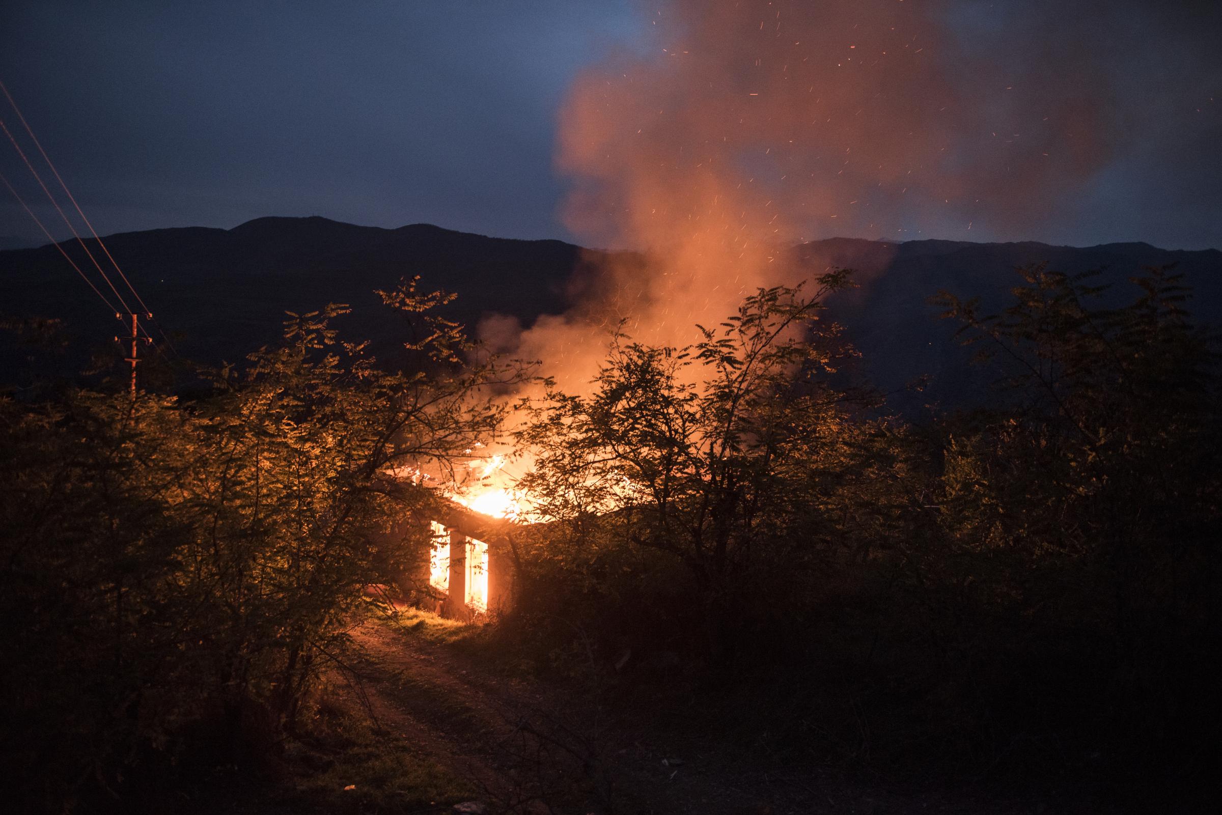 Paradise Lost - A burning house in the Kelbajar region of Nagorno-Karabakh. According to the peace agreement...