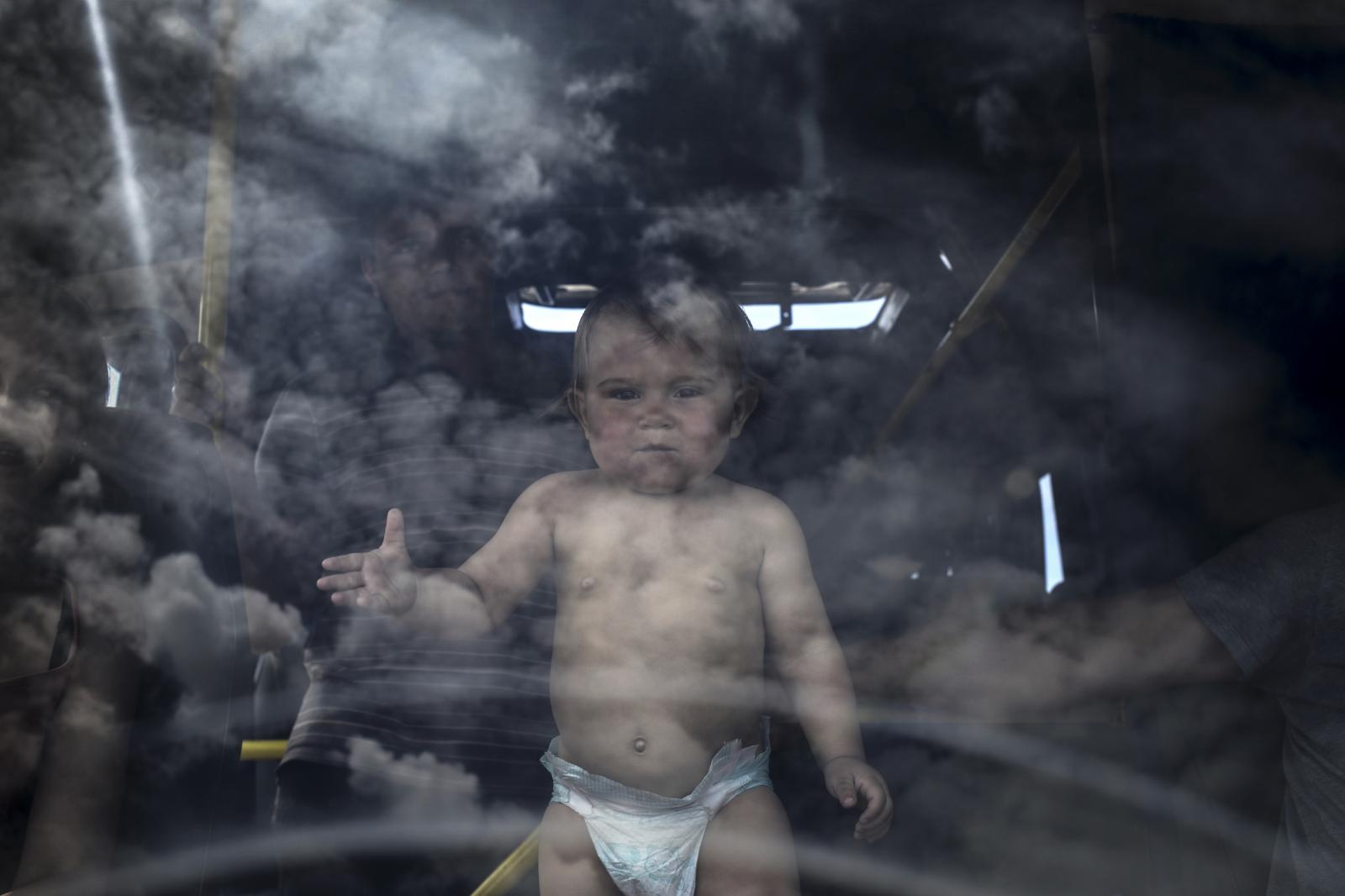 Refugee family and their child ...oint Izvarino in Luhansk region