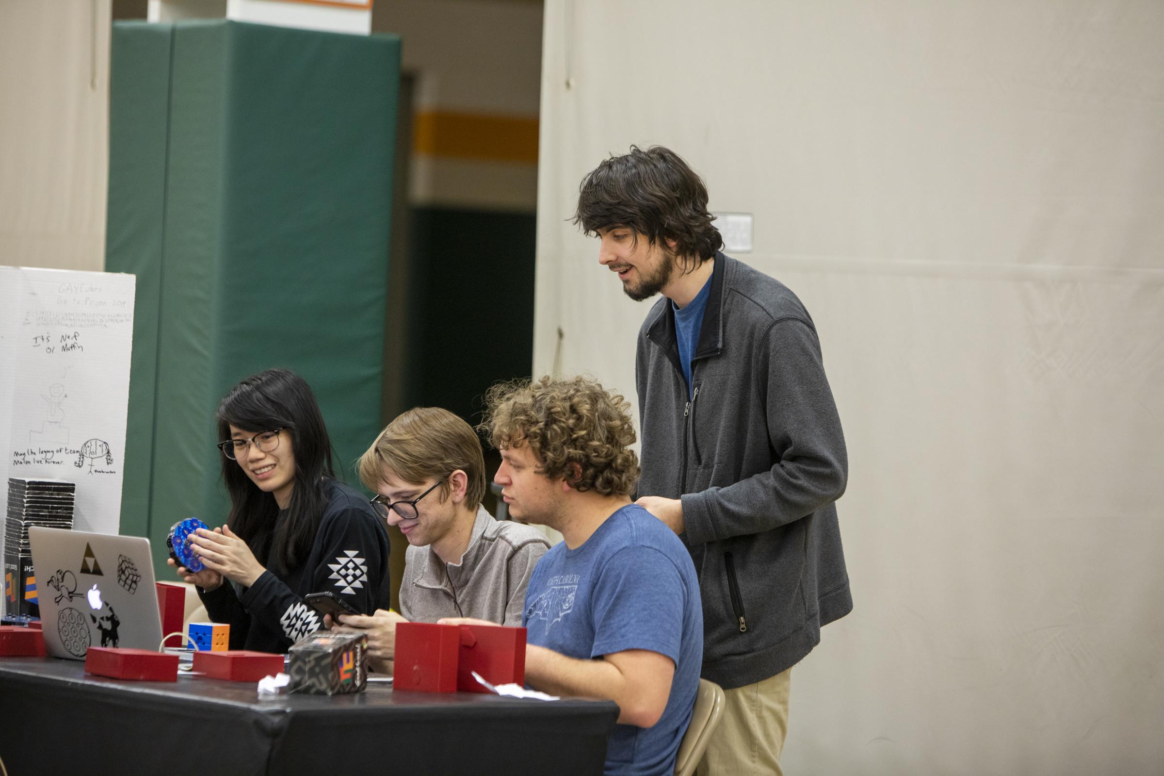 Speedcubers - Event coordinators scramble cubes during each event. Competitors have five attempts each round at...