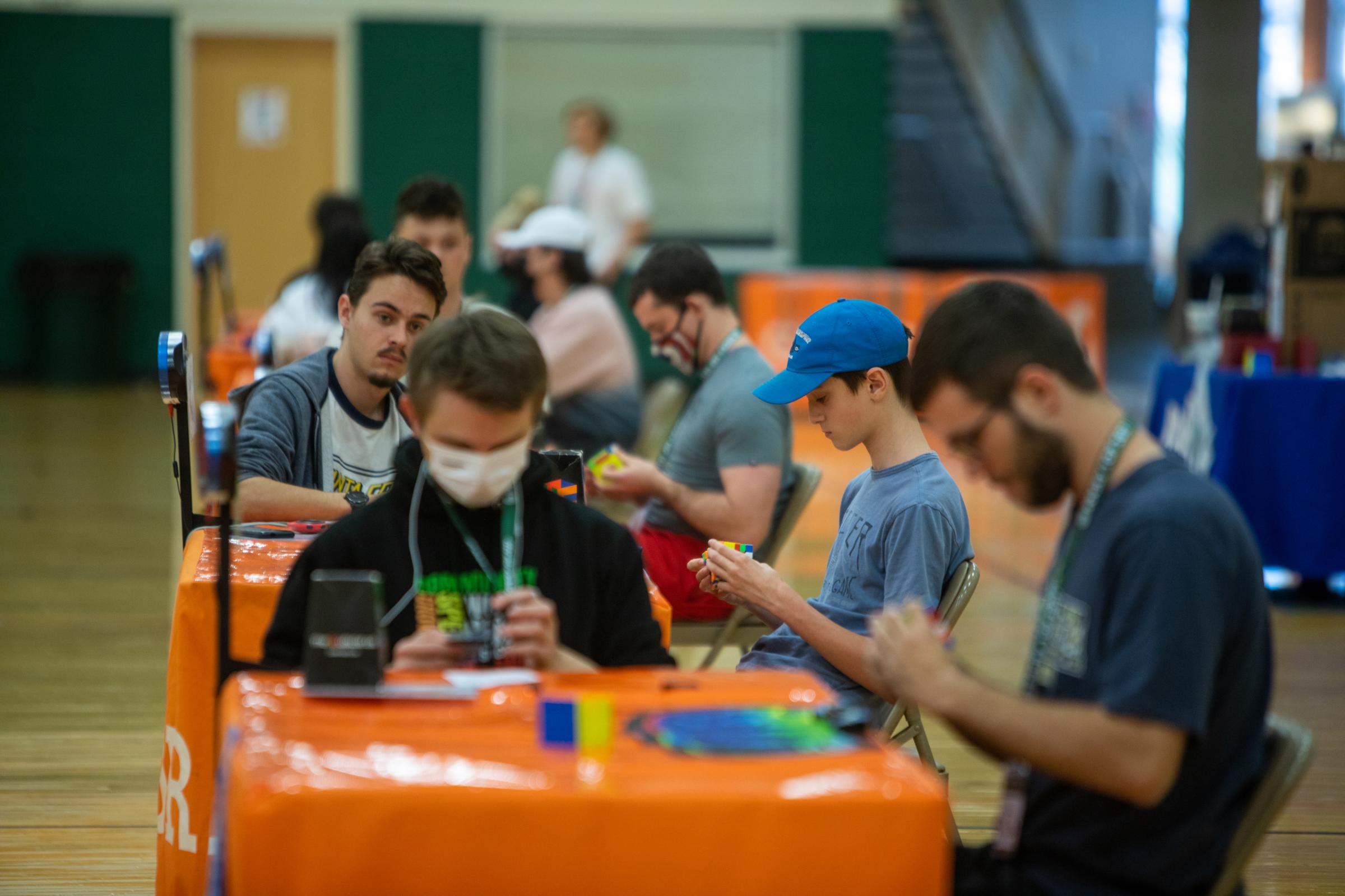 Speedcubers - During events, tables are set up with clocks so spectators can watch the times. Each table...