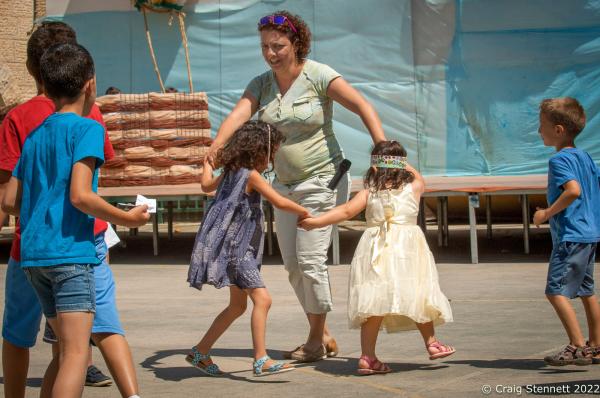 KAFR QARA, ISRAEL-MAY 30: Theatre teacher Shuli Kelin dances with some of the Kindergarden students at rehersals for the end of year ceremony to at Wadi Ara Hand in Hand School in Kafr Qara, Haifa District in Isreal on May 30th, 2016. The Hand in Hand educational School concept was given birth in 1997 by Amin Khalaf, an Arab teacher and lecturer, and Lee Gordon, a Jewish-American social activist, after they met while working in their respective fields promoting Arab-Jewish dialogue in Israel. The schools they pioneered host an equal number of Jewish and Arab students respectively. Two teachers simultaneously in both Arabic and Hebrew teach the lessons. Judaism, Islam and also Christianity are taught with equal weight to all students, and each faith&rsquo;s respective religious holidays are also observed. Emphasis is given not only to one&rsquo;s own culture and language but also to those of the &quot;other&quot;. The children study two accounts of history: the creation of the &quot;Jewish homeland&quot; as well as the narrative of the Palestinian struggle. (Photo by Craig Stennett/Getty Images)