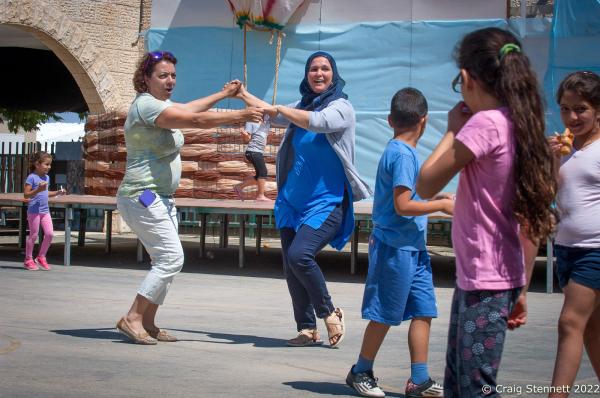 KAFR QARA, ISRAEL-MAY 30: Arab and Jewish Israeli school teachers Shuli Kelin and Amina Tamne get in the end of school term spirit with a dance in the playground at Wadi Ara Hand in Hand School in Kafr Qara, Haifa District, Isreal on May 30th, 2016. The Hand in Hand educational School concept was given birth in 1997 by Amin Khalaf, an Arab teacher and lecturer, and Lee Gordon, a Jewish-American social activist, after they met while working in their respective fields promoting Arab-Jewish dialogue in Israel. The schools they pioneered host an equal number of Jewish and Arab students respectively. Two teachers simultaneously in both Arabic and Hebrew teach the lessons. Judaism, Islam and also Christianity are taught with equal weight to all students, and each faith&rsquo;s respective religious holidays are also observed. Emphasis is given not only to one&rsquo;s own culture and language but also to those of the &quot;other&quot;. The children study two accounts of history: the creation of the &quot;Jewish homeland&quot; as well as the narrative of the Palestinian struggle. (Photo by Craig Stennett/Getty Images)