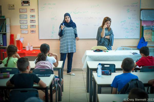 JERUSALEM, ISRAEL-JUNE 02: Two teachers, one an Arab Israeli the other Jewish teach simultaneously in Hebrew and Arabic at the Jerusalem Hand in Hand School in Israel on June 2nd, 2016. Alia Hussien (left) and fellow teacher Efrat Toval give a lesson on identity to this class of 3rd Grade students. The Hand in Hand educational School concept was given birth in 1997 by Amin Khalaf, an Arab teacher and lecturer, and Lee Gordon, a Jewish-American social activist, after they met while working in their respective fields promoting Arab-Jewish dialogue in Israel. The schools they pioneered host an equal number of Jewish and Arab students respectively. Two teachers simultaneously in both Arabic and Hebrew teach the lessons. Judaism, Islam and also Christianity are taught with equal weight to all students, and each faith&rsquo;s respective religious holidays are also observed. Emphasis is given not only to one&rsquo;s own culture and language but also to those of the &quot;other&quot;. The children study two accounts of history: the creation of the &quot;Jewish homeland&quot; as well as the narrative of the Palestinian struggle. (Photo by Craig Stennett/Getty Images)