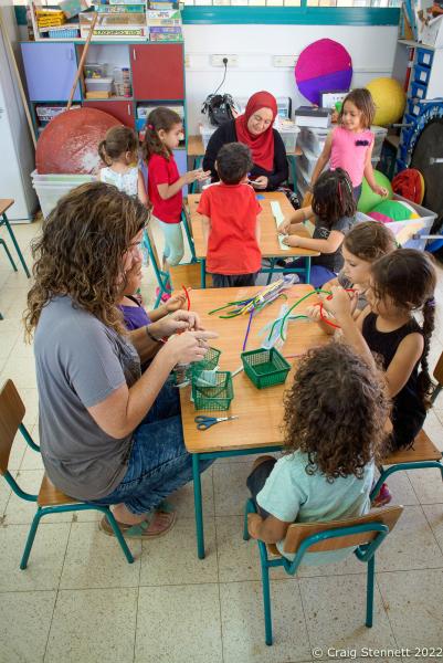 KAFR QARA, ISRAEL-MAY 30: Mixed faith, Arab and Jewish, Israeli teachers Daisy Yaakov and Layati Kaboha taking a kindergarden class at Wadi Ara, Hand in Hand School, Kafr Qara, Israel on May 30th, 2016. The Hand in Hand educational School concept was given birth in 1997 by Amin Khalaf, an Arab teacher and lecturer, and Lee Gordon, a Jewish-American social activist, after they met while working in their respective fields promoting Arab-Jewish dialogue in Israel. The schools they pioneered host an equal number of Jewish and Arab students respectively. Two teachers simultaneously in both Arabic and Hebrew teach the lessons. Judaism, Islam and also Christianity are taught with equal weight to all students, and each faith&rsquo;s respective religious holidays are also observed. Emphasis is given not only to one&rsquo;s own culture and language but also to those of the &quot;other&quot;. The children study two accounts of history: the creation of the &quot;Jewish homeland&quot; as well as the narrative of the Palestinian struggle. (Photo by Craig Stennett/Getty Images)