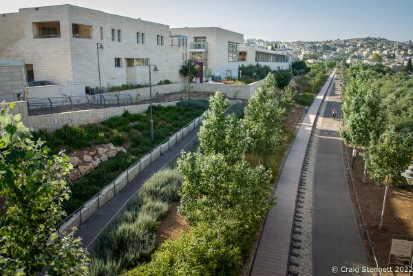 Image from A BluePrint for Peace-Hand in Hand, Israel-Getty Images - JERUSALEM, ISRAEL-JUNE 02:A lone cyclist passes the Hand...