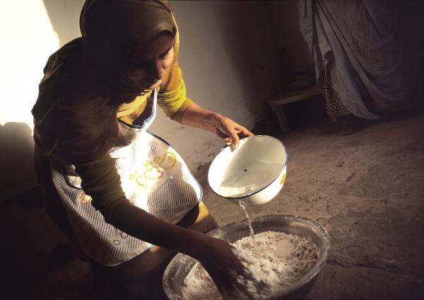Daughters of the clouds - Gadfa Yaacob makes some bread in the early hours of the day before attending her duties as a...