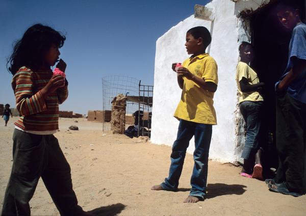 Daughters of the clouds - Refugee children eating icecream at the refugee camps of Tindouf, Algeria.