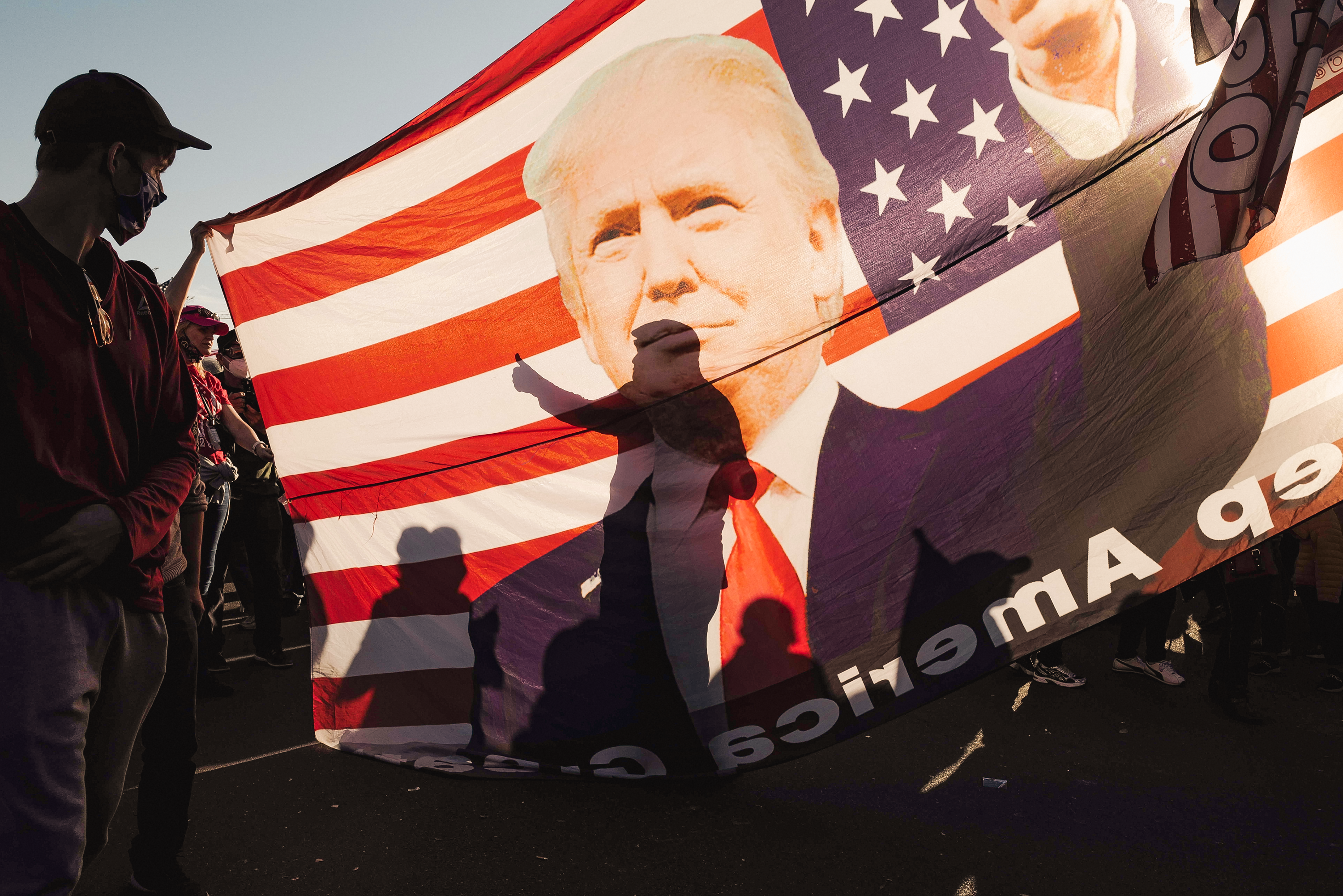 Image from Politics Singles -  A shadow of a supporter of former President Donald Trump...