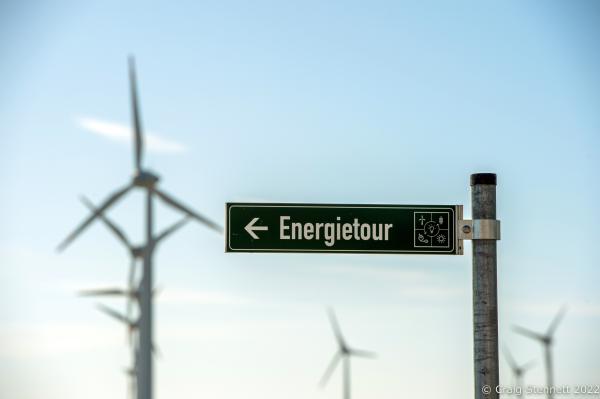 Image from Feldheim, Germany 100% Energy self-sufficient-Getty Editorial - FELDHEIM, GERMANY-OCTOBER 13: A street sign with wind...