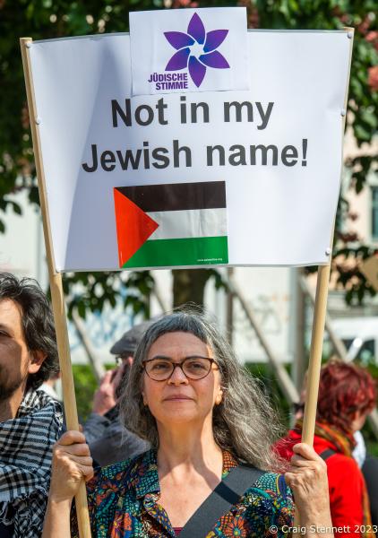 Jewish Berliners show support for Palestinian rights. - BERLIN, GERMANY - MAY 20: A woman holds a banner at a...