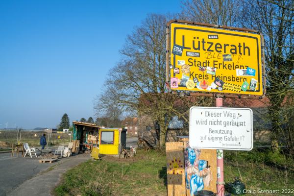 L&Uuml;TZERATH, GERMANY- MARCH 24: A protester walks into L&uuml;tzerath, Nordrhein-Westfalen, Germany on March 24, 2022.. An environmental camp &#39;Mahnwache L&uuml;tzerath&#39; (Vigil L&uuml;tzerath) was set up at the village in 2020 on the land of L&uuml;tzerath Farmer Eckart Heukamp to protest against the expansion of the Garzweiler open-cast lignite mine. Most of the former properties in L&uuml;tzerath have already been demolished to make way for the mine but Eckart Heukamp has contested the RWEs (the energy provider who owns the mine) right to forcibly take his farm. The case is currently progressing through the German court system. The enviromentalists and their camp is intended to give support to Eckart Heukamp and opposition to any forcible attempt to clear his farm and land. (Photo by Craig Stennett/Getty Images)