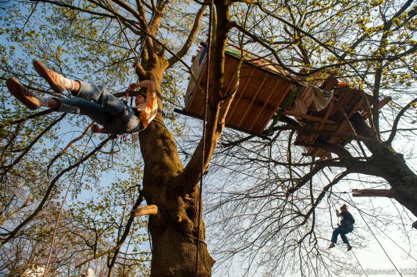 L&Uuml;TZERATH, GERMANY- MARCH 24: Environmental protesters practice rope climbing skills in order to reach the tree houses at the environmental protest camp of &#39;Mahnwache L&uuml;tzerath&#39; on March 24, 2022 in L&uuml;tzerath, Nordrhein-Westfalen, Germany. The environmental camp was set up in 2020 on the land of L&uuml;tzerath Farmer Eckart Heukamp to protest against the expansion of the Garzweiler open-cast lignite mine. Most of the former properties in L&uuml;tzerath have already been demolished to make way for the mine but Eckart Heukamp has contested the RWEs (the energy provider who owns the mine) right to forcibly take his farm. The case is currently progressing through the German court system. (Photo by Craig Stennett/Getty Images)