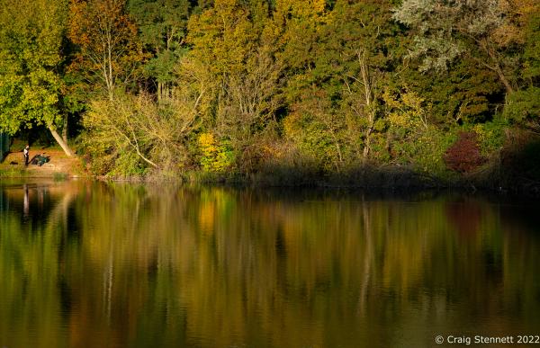 HALLE (NEUSTADT), GERMANY-OCTOBER 13:The Bruchsee (also called Graebsee ) is a ma made lake in the Neustadt district of Halle (Saale) photographed on October 13, 2021. The Bruchsee is a flooded limestone quarry. From 1891 to 1921 a limestone quarry existed on the site of today&#39;s lake. Shell limestone , formed in the Triassic around 240 to 233 million years ago, was mined from here. The lime was used to make cement . The mining eventuall ended and the lake was created by inflowing rainwater and groundwater . From 1921 until the 1950s, a wood processing company owned by the Graeb family existed on the southern shore of the lake (this is where the popular name Graebsee comes from), using the lake to water tree trunks. Structural remnants of the business above the south bank were preserved until the mid-1990s and were only demolished when new residential buildings were built. In the 1970s there were plans to terrace part of the bluff and build a caf&eacute; for excursions. However, the plans never came to fruition. In 1979, the western part of the Bruchsee with its steep face was placed under protection as a natural monument .For many years, part of the water from the lake was used to air-condition the Prisma cinema, which was built in 1982/83 . With the demolition of the cinema, the associated regulation was dropped, so that the water level rose noticeably in the years that followed. Since the installation of a new pump, excess water is constantly being transferred to the nearby Saugraben , which then reaches the Saale . The lake is now part of the groundwater management system for Halle-Neustadt. (Photo by Craig Stennett)