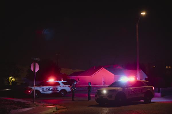 Image from Singles - Officers from the Albuquerque Police Department secure a...