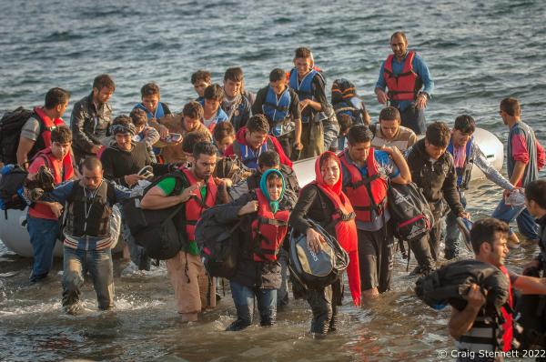 EFTALOU, GREECE-SEPTEMBER 21: Refugees disembark after arrival by dingy crossing the Aegean Sea at Limanaki Beach in Eftalou, Lesbos, Greece in 2015. In all, over 1 million refugees and migrants crossed the Mediterranean (mostly the Aegean Sea) in 2015, three to four times more than the previous year. 80% were fleeing from wars in Syria, Iraq, and Afghanistan. About 85% of sea arrivals were in Greece via Turkey.(Photo by Craig Stennett/Getty Images)