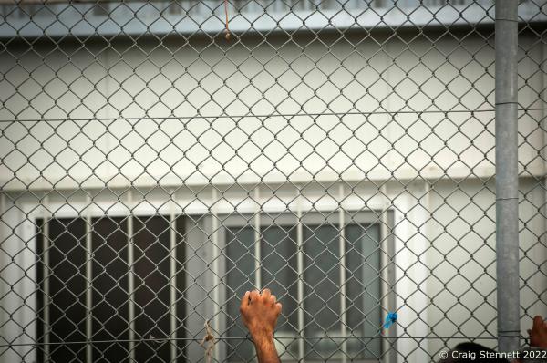 Image from 7 Days in Lesbos - MORIA REFUGEE CAMP, GREECE-SEPTEMBER 22: A refugee holds...
