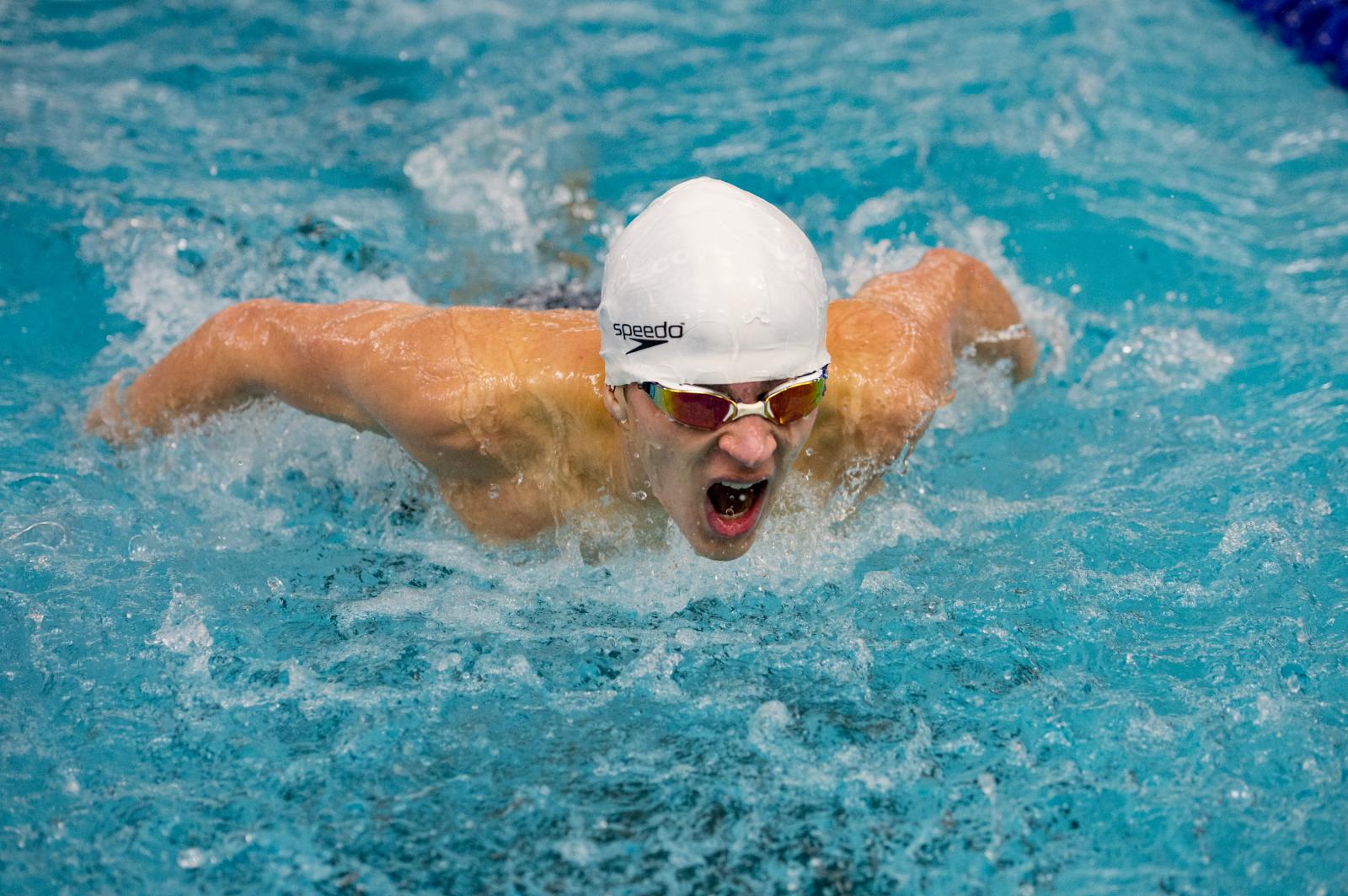 South Lake High School&#39;s Nolan Gervin competes in the 100 Yard Butterfly during the meet...