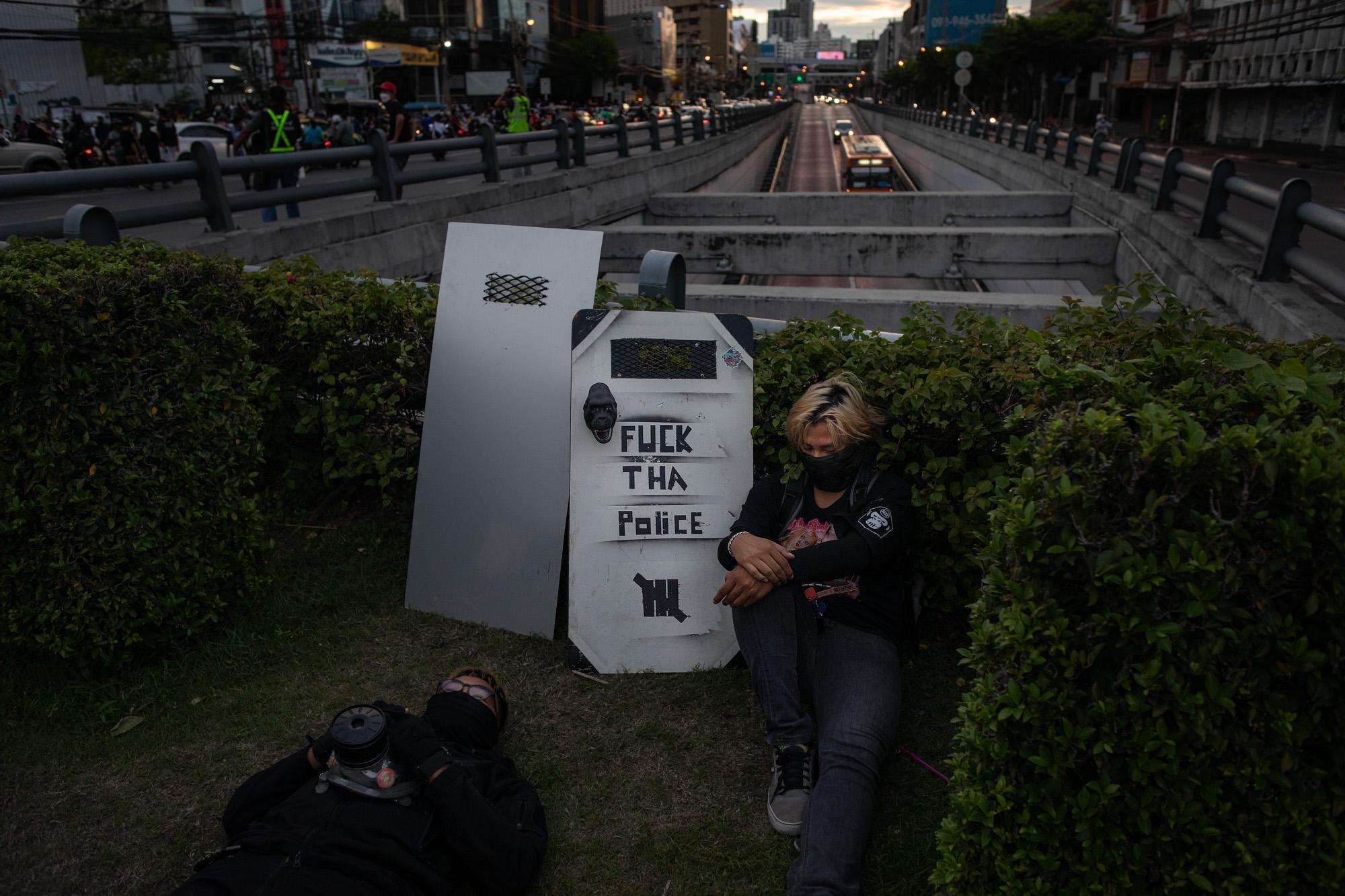 Thailand's Youth Fights Back - Pro-democracy protestors rest during clashes with riot...