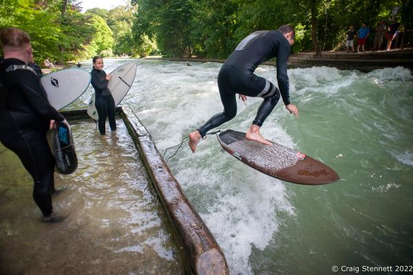 Surfing the Eisbachwelle, Munich, Bavaria, Germany - MUNICH, GERMANY - JUNE 15: A surfer entering the...