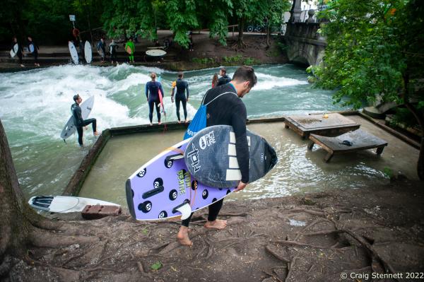 MUNICH, GERMANY - JUNE 15: Local Munich River Surfer Alex Neumann prepares to start the day surfing at the Eisbach, Munich, Bavaria, Germany in 2019. The Eisbach (Ice Brook) is a 2 kilometer man made river which is in effect a canal tributary from Bavaria&lsquo;s Isar River. It runs through Munich&lsquo;s Englischer Garten, a public park, and is the hub of the land locked city&rsquo;s surf scene The river, following enhancement from local surfers, produces a standing wave called the Eisbachwelle (Ice Brook Wave). It has been surfed in the city since the early 1970&rsquo;s. Munich now claims to be home to some 2000 full time surfers. (Photo by Craig Stennett/Getty Images)
