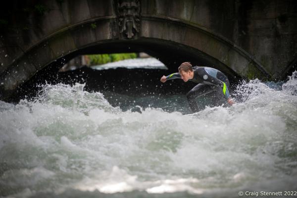 MUNICH, GERMANY - JUNE 15: A surfer at the Eisbachwelle in Munich, Bavaria, 2019. The Eisbach (Ice Brook) is a 2 kilometer man made river which is a canal tributary from the Isar River. It runs through Munich&lsquo;s Englischer Garten, a public park, and is the hub of the land locked city&rsquo;s surf scene. The river, following enhancement from local surfers, produces a standing wave called the Eisbachwelle (Ice Brook Wave). It has been surfed in the city since the early 1970&rsquo;s. Munich now claims to be home to some 2000 full time surfers. (Photo by Craig Stennett/Getty Images)