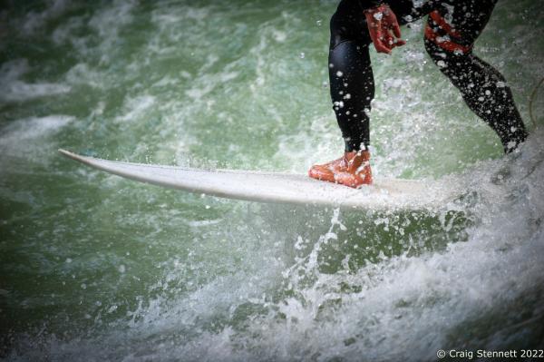 Surfing the Eisbachwelle, Munich, Bavaria, Germany - MUNICH, GERMANY - JUNE 15: A surfer at the Eisbachwelle...