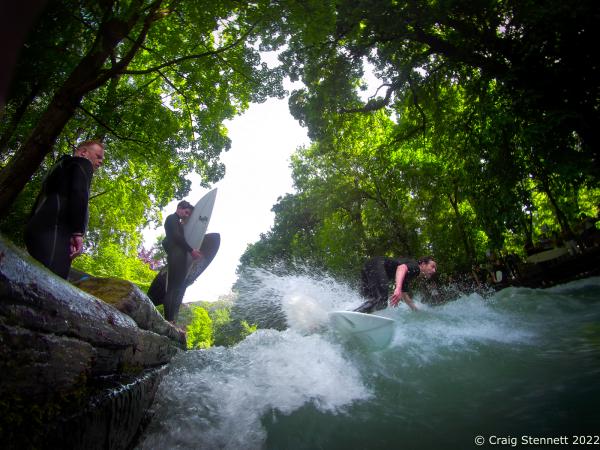 MUNICH, GERMANY - JUNE 15: Quirin Rohleder co-founder of the Rapid Surf League-an organising body for river surfing- surfing the river Eisbach in Munich, Bavaria in 2019. The Eisbach (Ice Brook) is a 2 kilometer man made river running through Munich&lsquo;s Englischer Garten, a public park, and is the hub of the land locked city&rsquo;s surf scene The river, following enhancement from local surfers, produces a standing wave called the Eisbachwelle (Ice Brook Wave). It has been surfed in the city since the early 1970&rsquo;s, with Munich now claiming to be home to some 2000 full time surfers. (Photo by Craig Stennett/Getty Images)